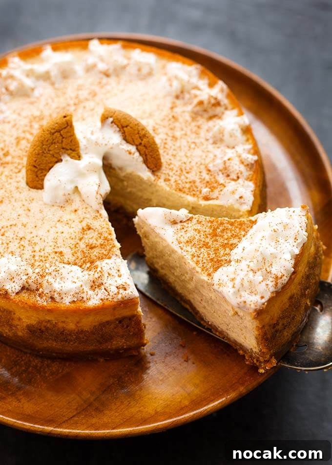 Thanksgiving Recipes for Instant Pot: Fast Holiday Favorites 20 Eggnog Cheesecake on a wooden plate with a slice being removed
