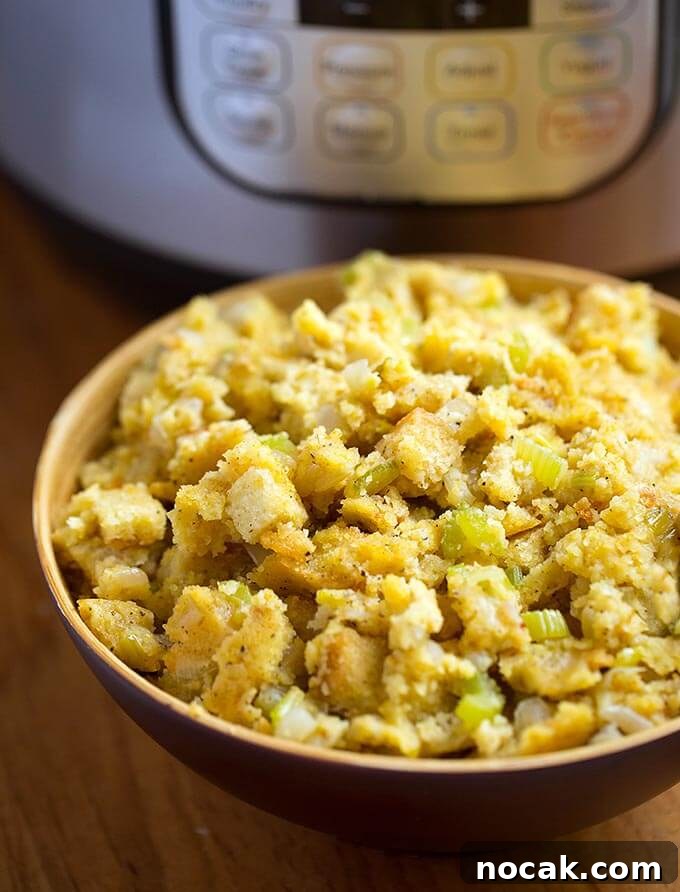 Thanksgiving Recipes for Instant Pot: Fast Holiday Favorites 6 Cornbread Stuffing in a brown bowl in front of a pressure cooker