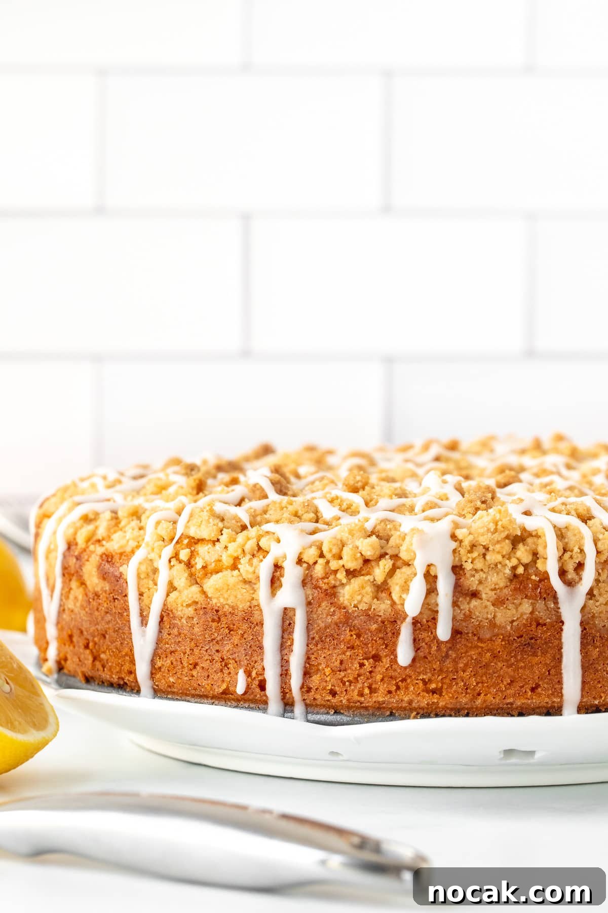 Lemon Coffee Cake Recipe: Moist Citrus Bundt Cake for Brunch 3 9-inch round lemon coffee cake with streusel topping drizzled with glaze