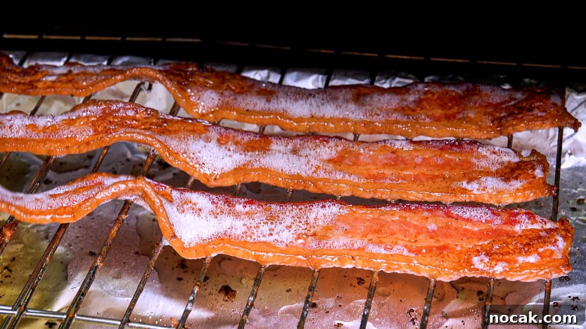 Crispy Smoked Bacon Recipe for Perfectly Crunchy Strips 5 Cooked bacon on smoker rack