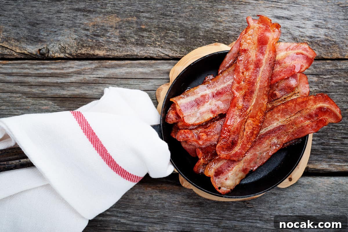 Crispy Smoked Bacon Recipe for Perfectly Crunchy Strips 10 Bacon in frying pan with towel