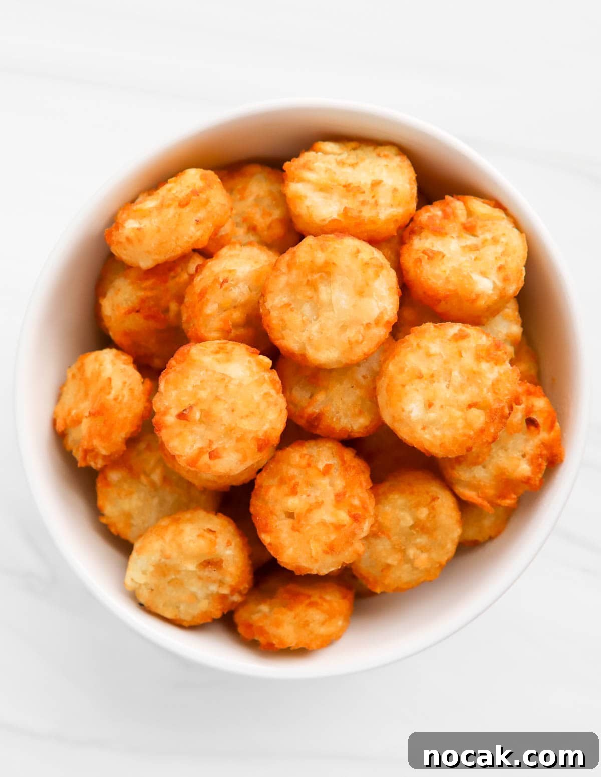A white bowl filled with crispy crowns.