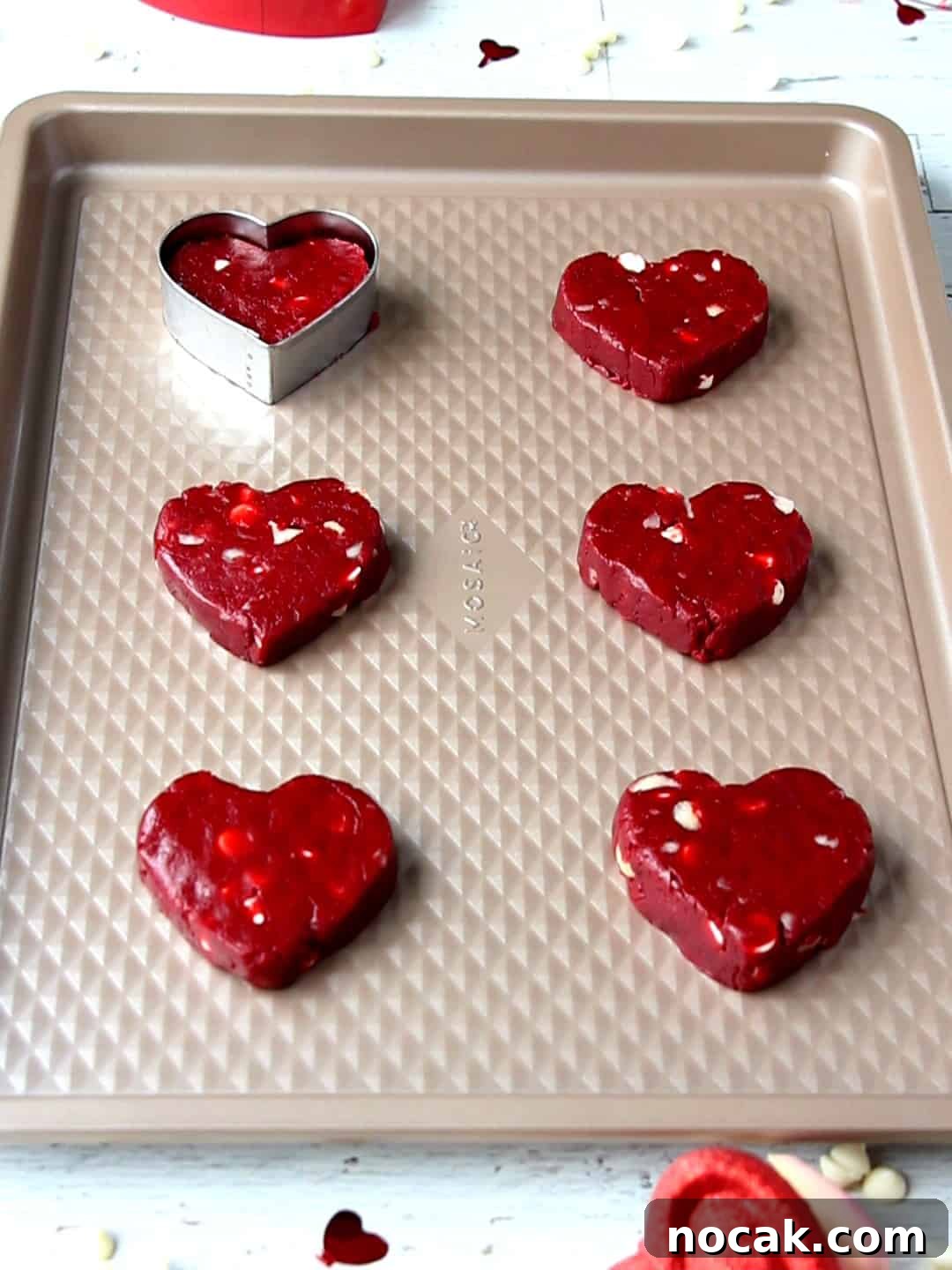Red Velvet Heart Cookies: Soft Valentine’s Day Treats 11 heart cookies on baking sheet ready to go to oven