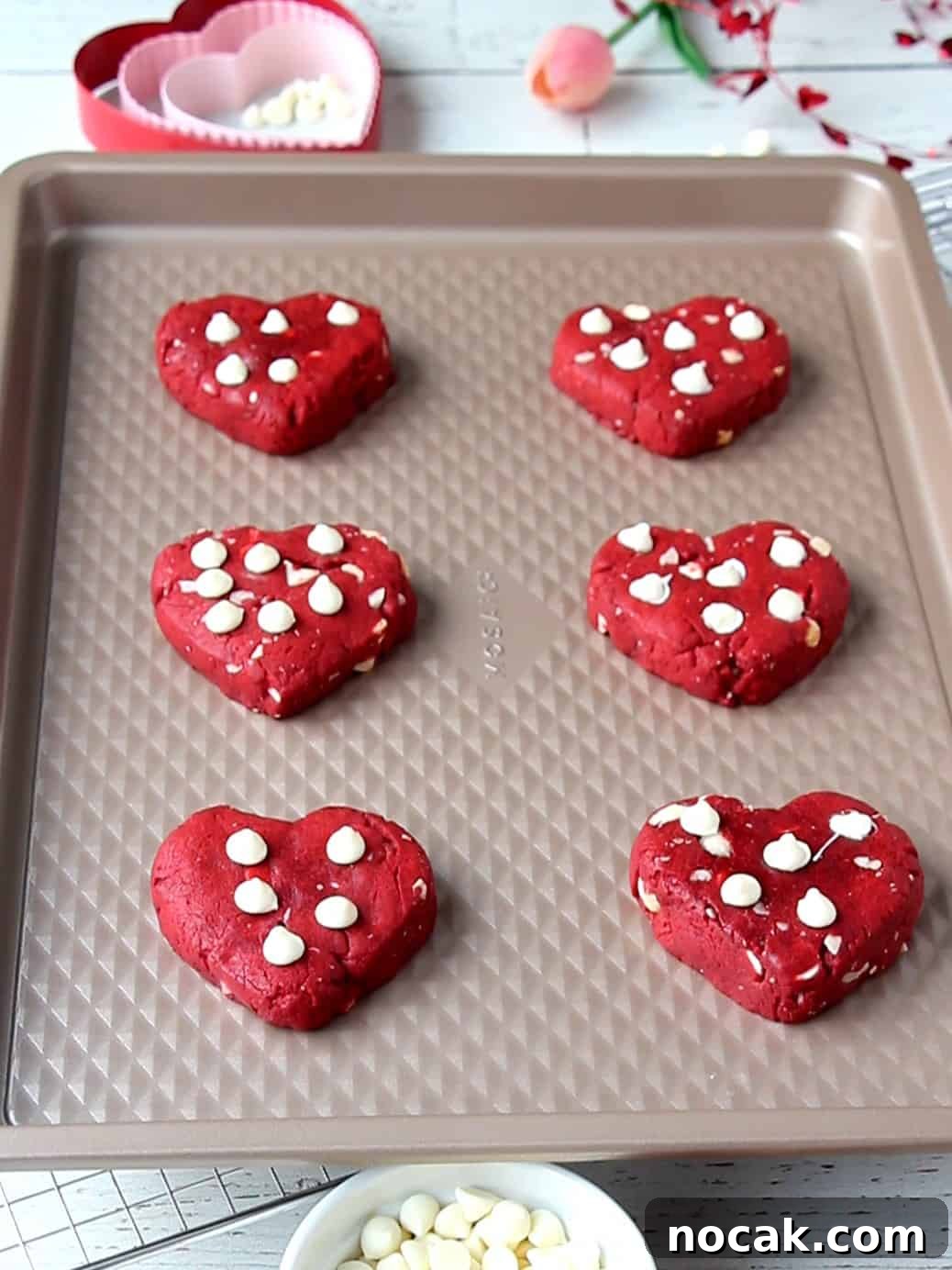 Red Velvet Heart Cookies: Soft Valentine’s Day Treats 12 heart cookies on baking sheet