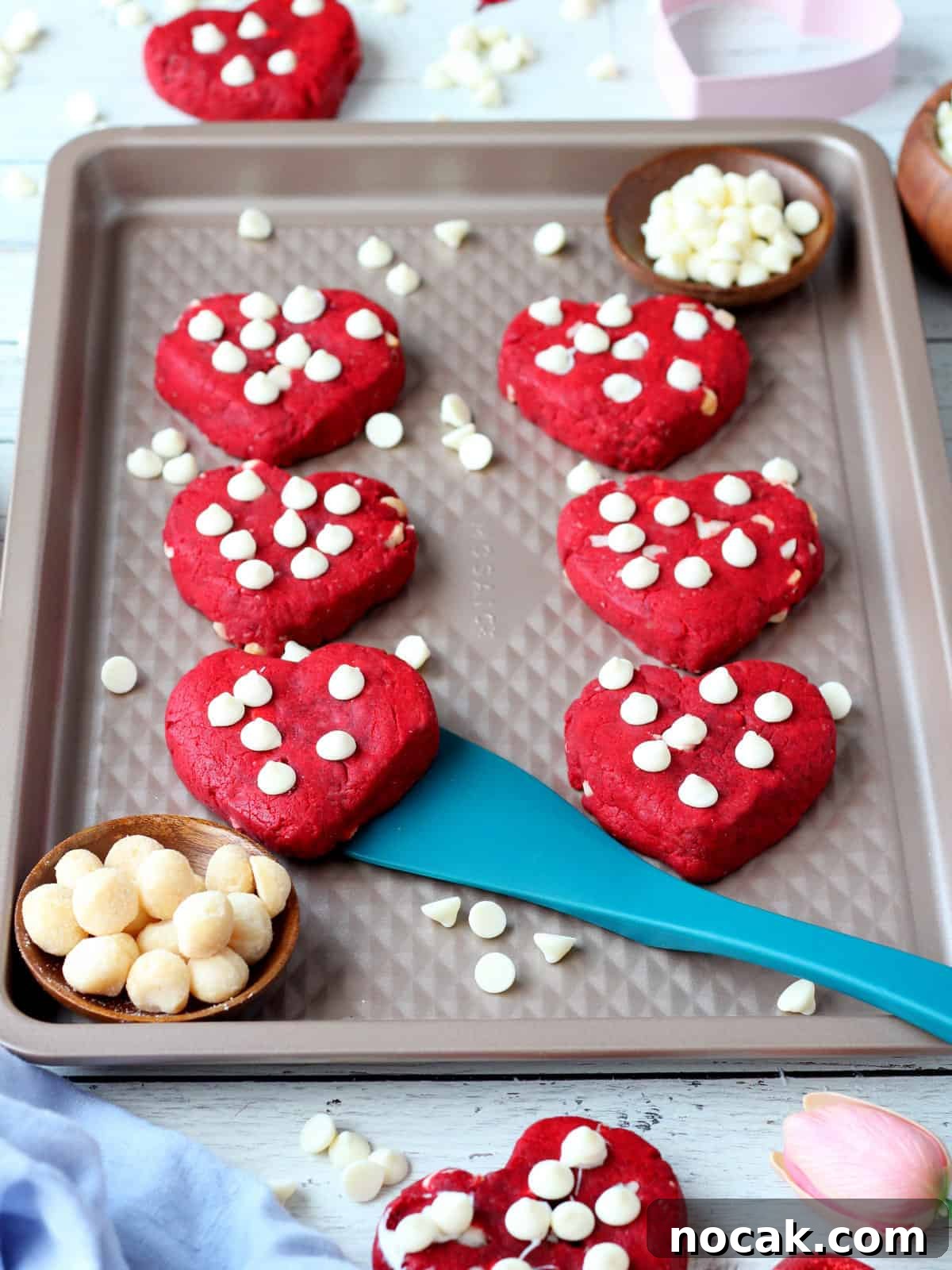 Red Velvet Heart Cookies: Soft Valentine’s Day Treats 14 heart cookies on non stick cookie sheet