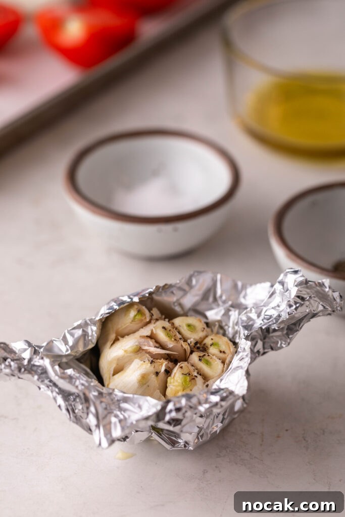 Creamy Sheet-Pan Roasted Tomato Soup 6 garlic bulb wrapped in foil and seasoned with salt and pepper