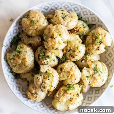 Crispy breakfast smashed potatoes in a serving bowl.