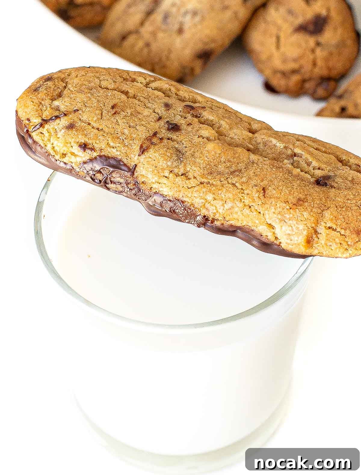 chocolate dunkers on top of a glass of milk