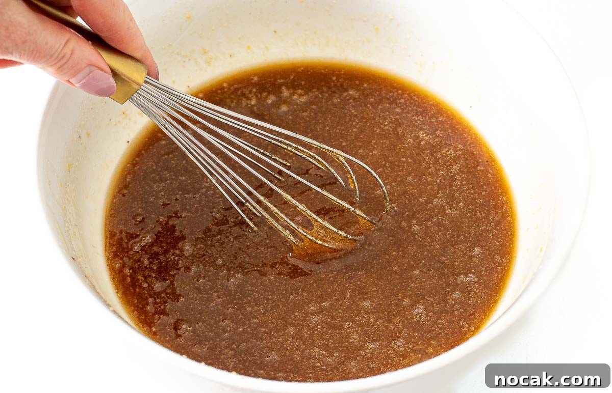 whisking wet ingredients for homemade dunker cookies