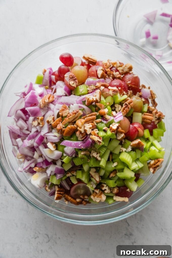 Sun-Drenched Sonoma Chicken Salad with Grapes & Almonds 5 Bowl full of Sonoma chicken salad in progress.