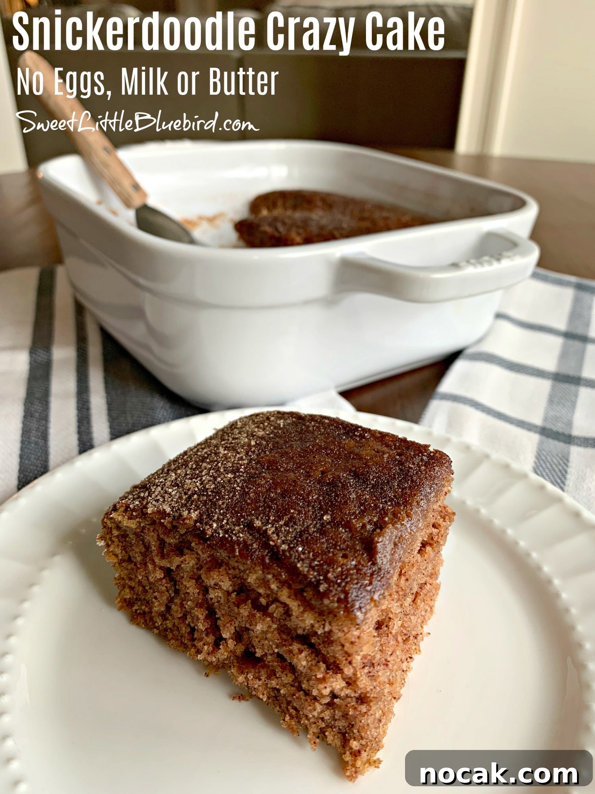 Snickerdoodle Crazy Cake — Eggless, Dairy-Free, Vegan Recipe 2 This is a photo of a piece of Snickerdoodle Crazy Cake served on a white plate with the cake pan behind the plate.
