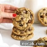 a stack of gluten-free oatmeal raisin chocolate chip cookies on a white background
