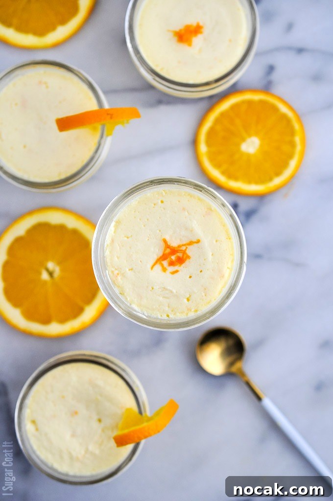 Single-serve jars of ginger cookie base and velvety, light-as-air Sous Vide Orange Mascarpone Cheesecake made with Tre Stelle Mascarpone.