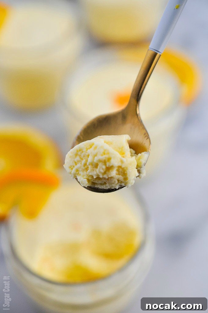 Single-serve jars of ginger cookie base and velvety, light-as-air Sous Vide Orange Mascarpone Cheesecake made with Tre Stelle Mascarpone.