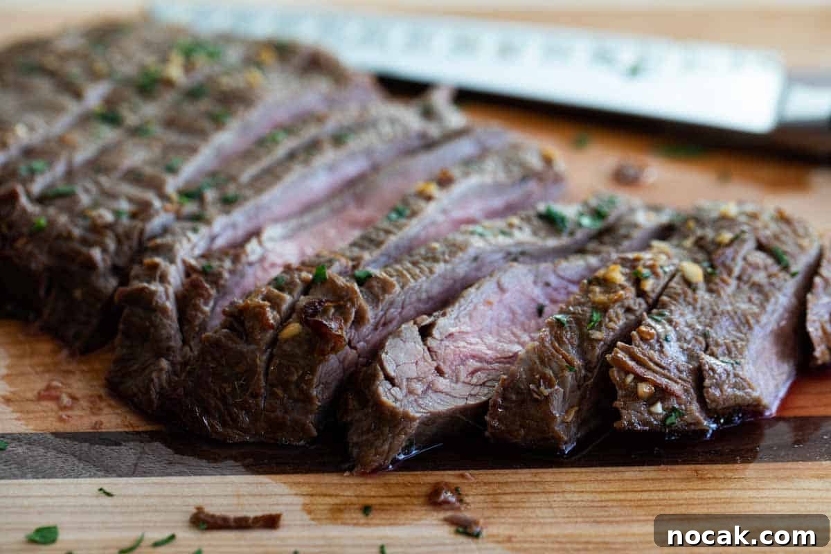 Flank Steak Marinade sliced flank steak on a cutting board