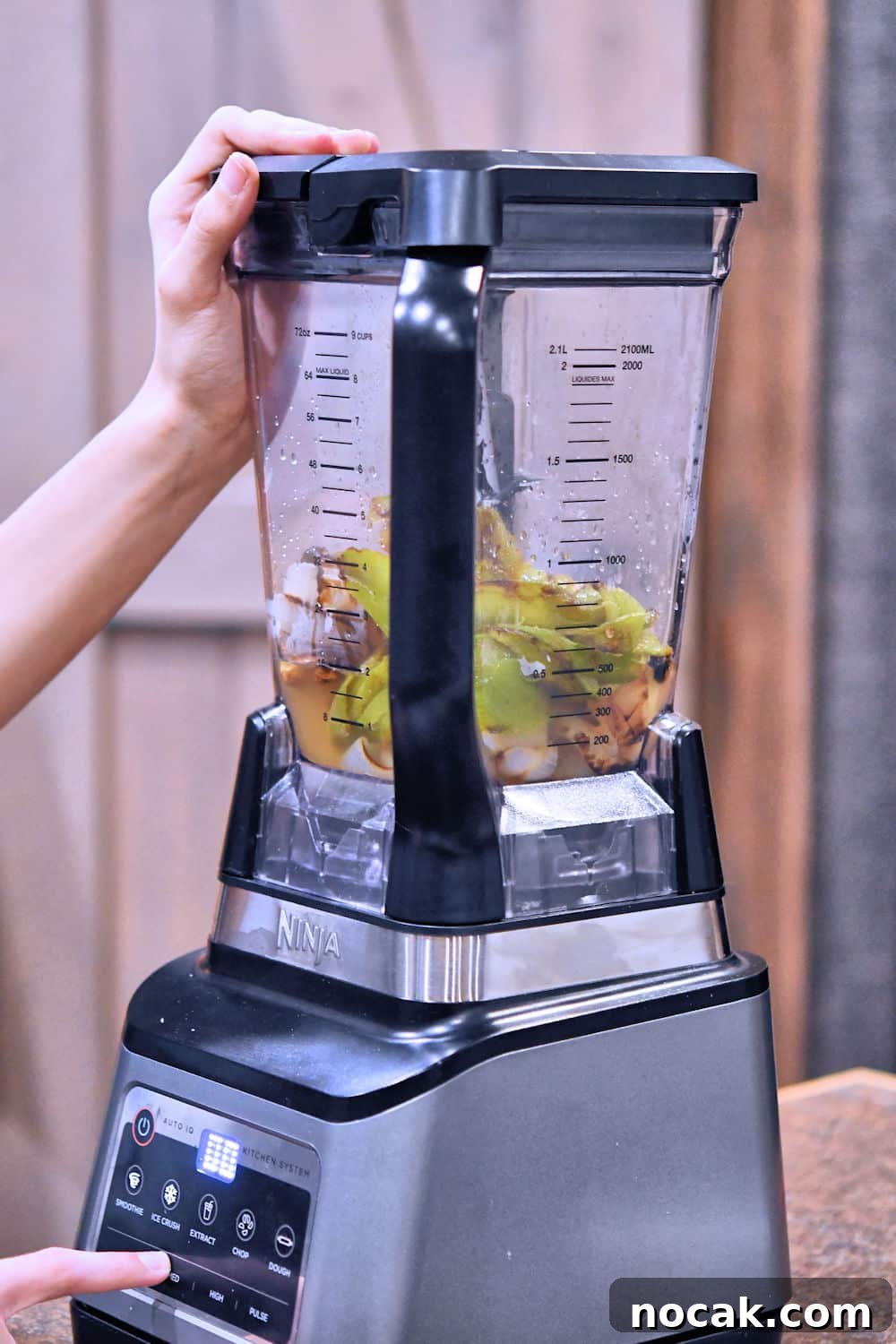 Authentic Green Chile Chicken Soup Recipe for Cozy Weeknights 8 roasted chiles and onions in a blender ready to be processed