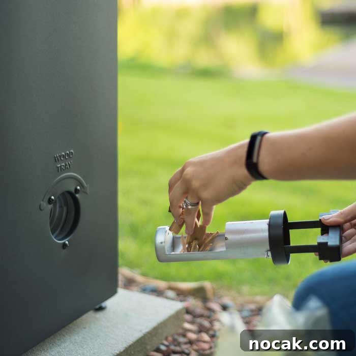 How to Use an Electric Smoker: 7 Simple Steps for Smoky Flavor 5 inserting wood chips into tube on electric smoker