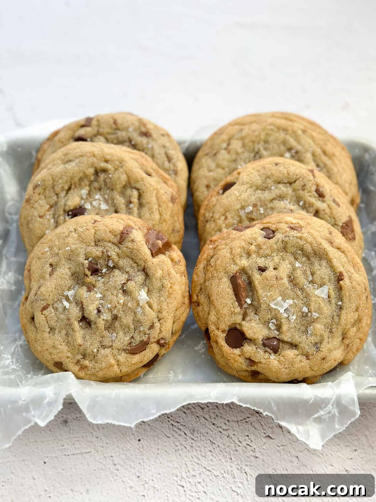 6 small batch brown butter chocolate chip cookies stacked together.
