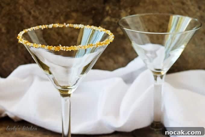 Salted Caramel Coffee Martini Recipe & How to Make It at Home 3 Two empty martini glasses, one rimmed with gold and white sugar.
