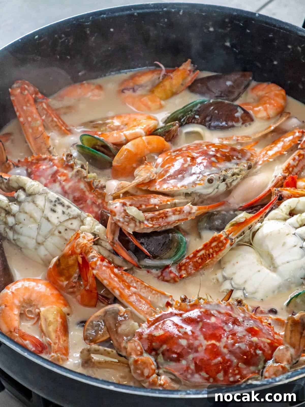 Seafood in Coconut Milk (Ginataang Seafood) Recipe 6 shrimp, crab, mussels, and squid simmering in coconut sauce