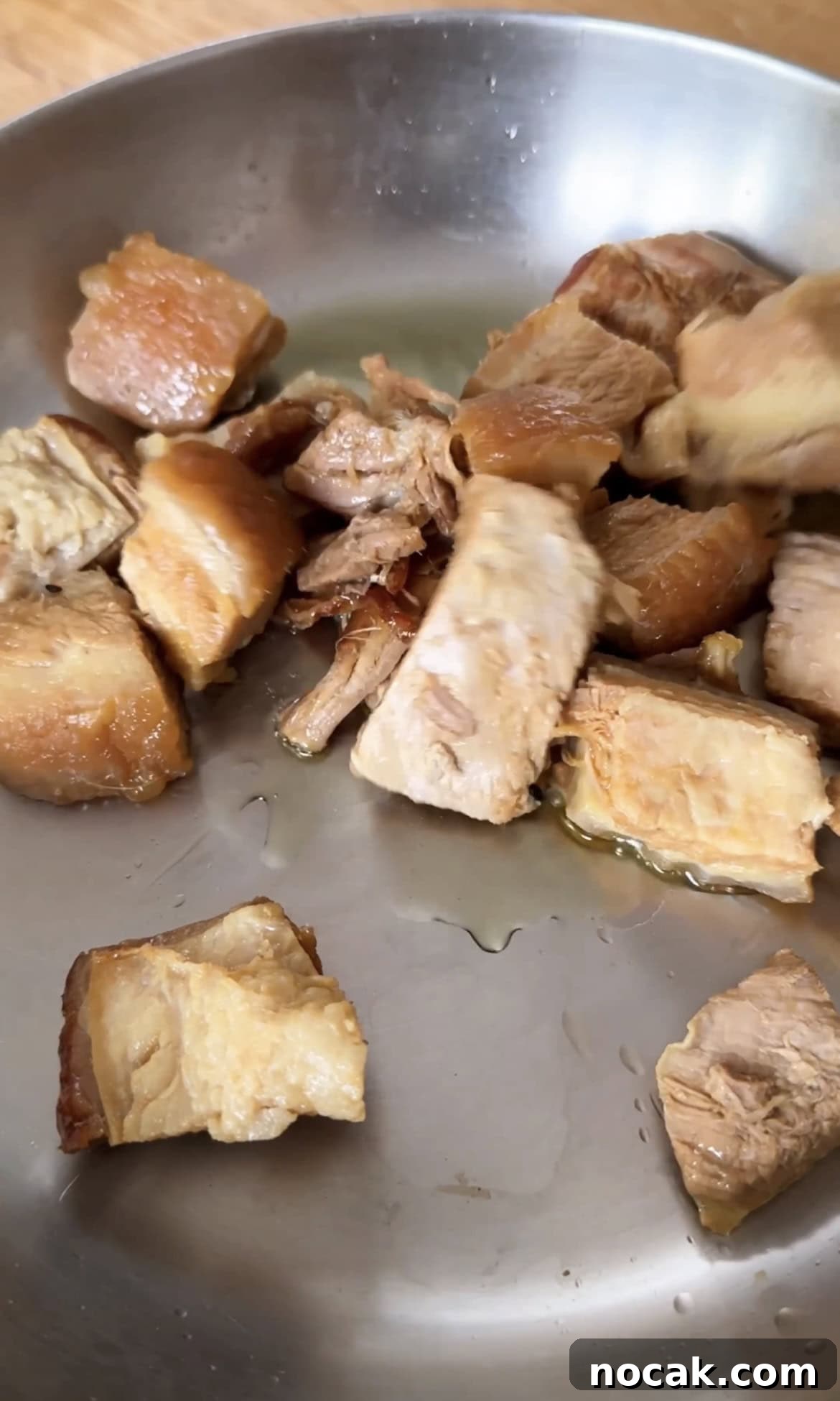 frying pork belly chunks.