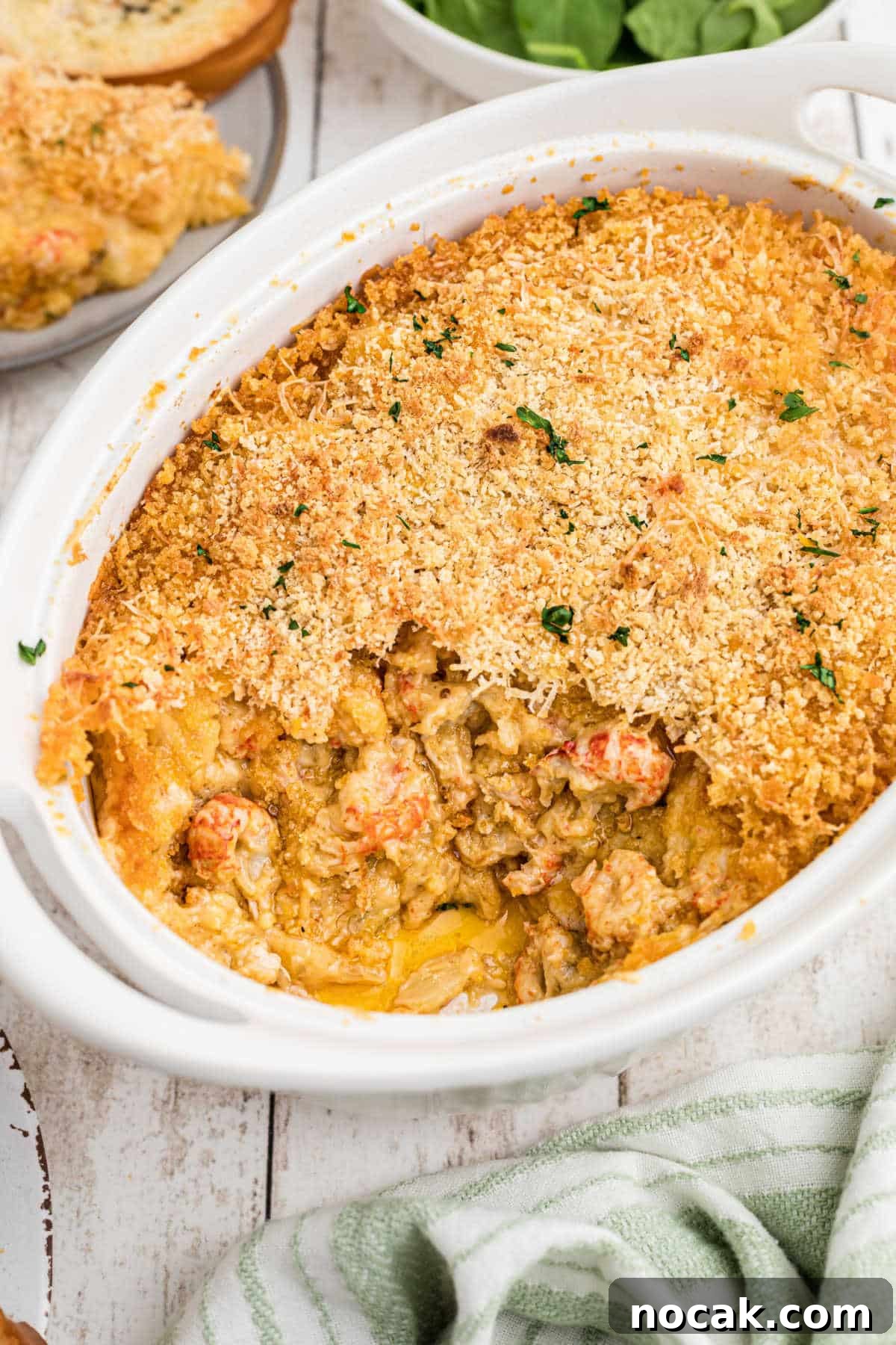 Crawfish-Stuffed Baked Potato Recipe 5 Portrait shot of a dish full of crawfish au gratin.