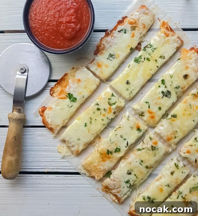 cheesy bread sticks with marinara sauce.