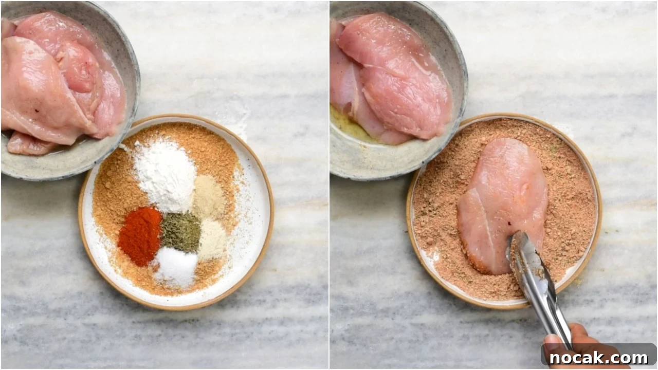 Crispy Air Fryer Chicken Breast 6 Pressing breadcrumbs onto chicken.