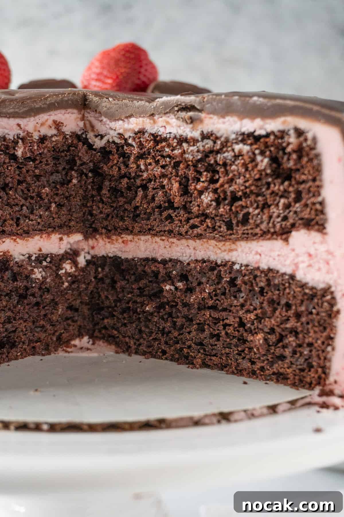 Chocolate Strawberry Layer Cake with Luscious Ganache 11 cross section of of chocolate cake with strawberry frosting.