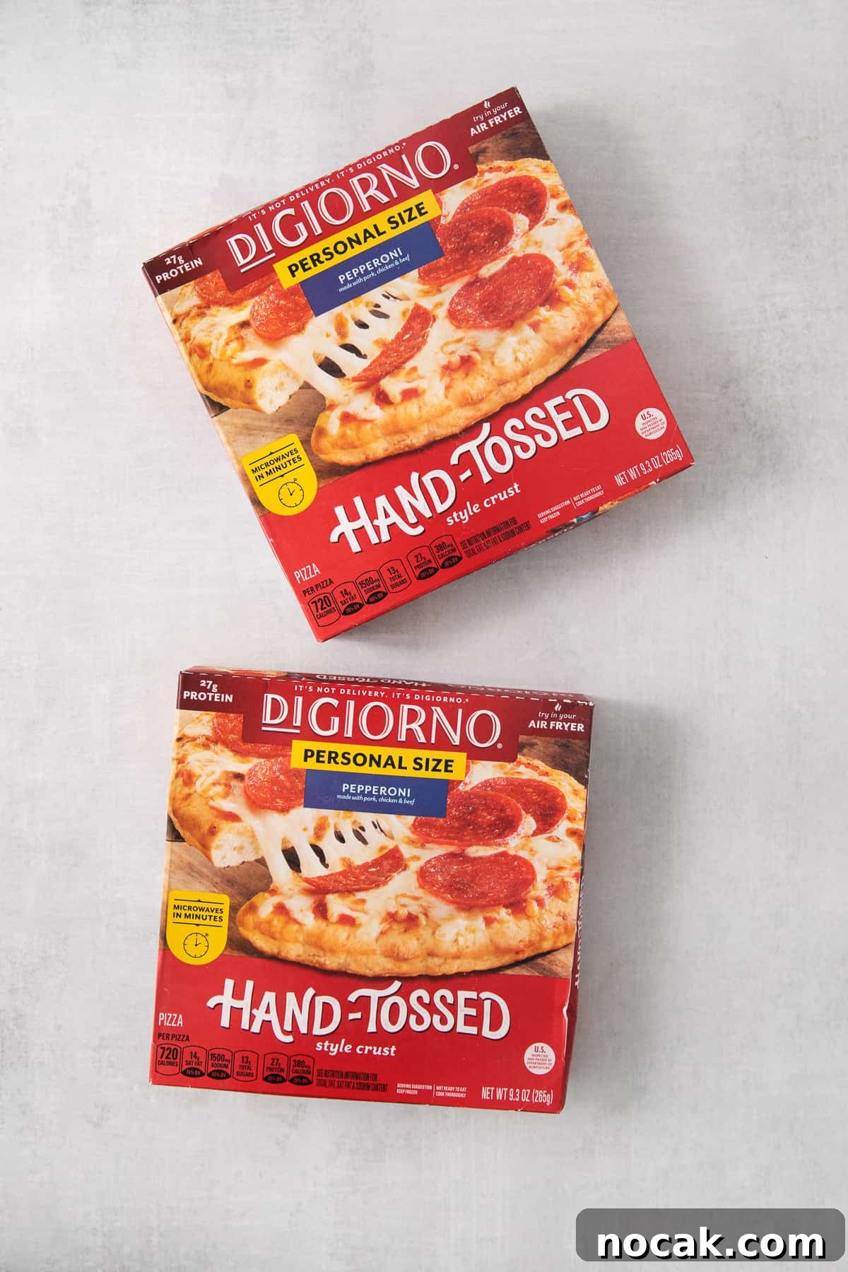 Frozen pizza boxes Boxes of frozen pizza on a counter.