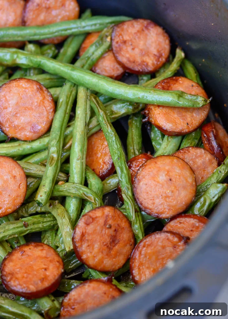 Crispy Air Fryer Green Beans with Smoked Sausage 2 Air Fryer Green Beans and Smoked Sausage is the ultimate 10 minute meal! This low carb dinner has only 6 net carbs per serving and is great for keto meal prep!