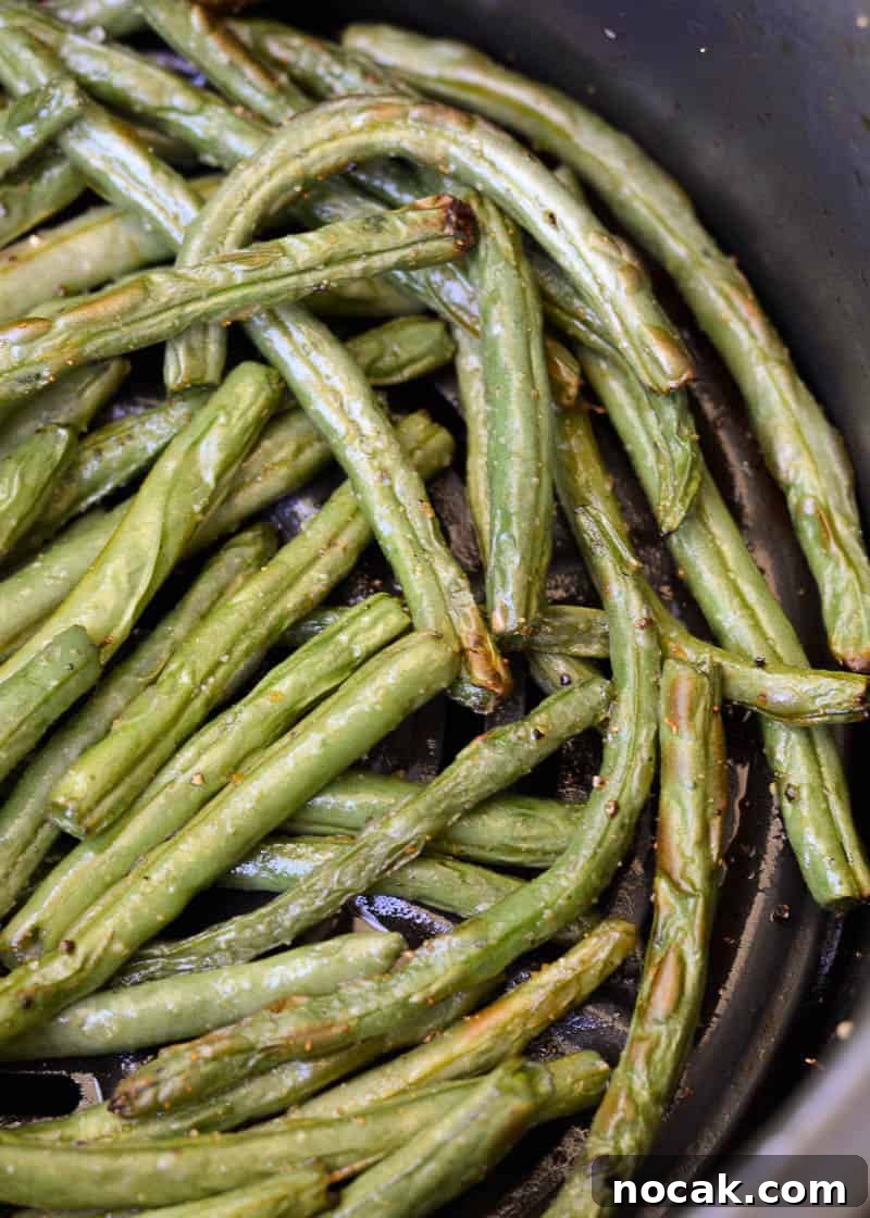 Crispy Air Fryer Green Beans with Smoked Sausage 3 Learn how to make easy Air Fryer Green Beans! Fresh green beans are paired with seasoning and lemon to make the perfect keto side dish!