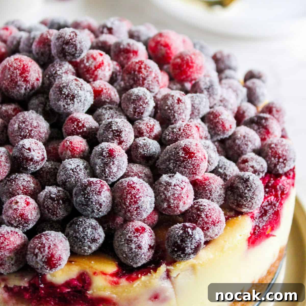 How to Meal Prep Your Thanksgiving Dinner 23 A fancy cranberry cheesecake on a table.