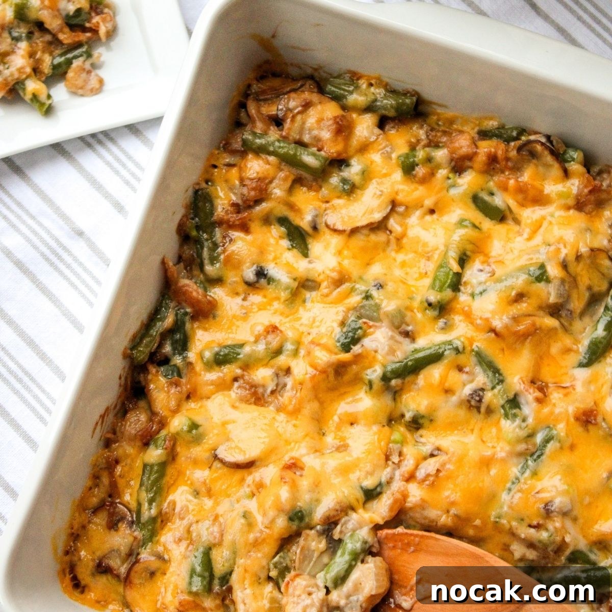 How to Meal Prep Your Thanksgiving Dinner 4 Casserole dish with paula deen green bean casserole and a plate served with the side dish.