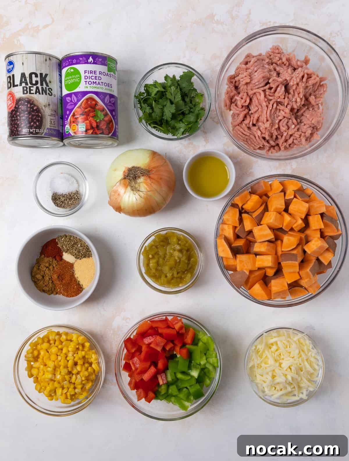 One-Pan Ground Turkey and Sweet Potato Skillet 4 Ground turkey, beans, tomatoes, bell pepper and other recipe ingredients on counter.
