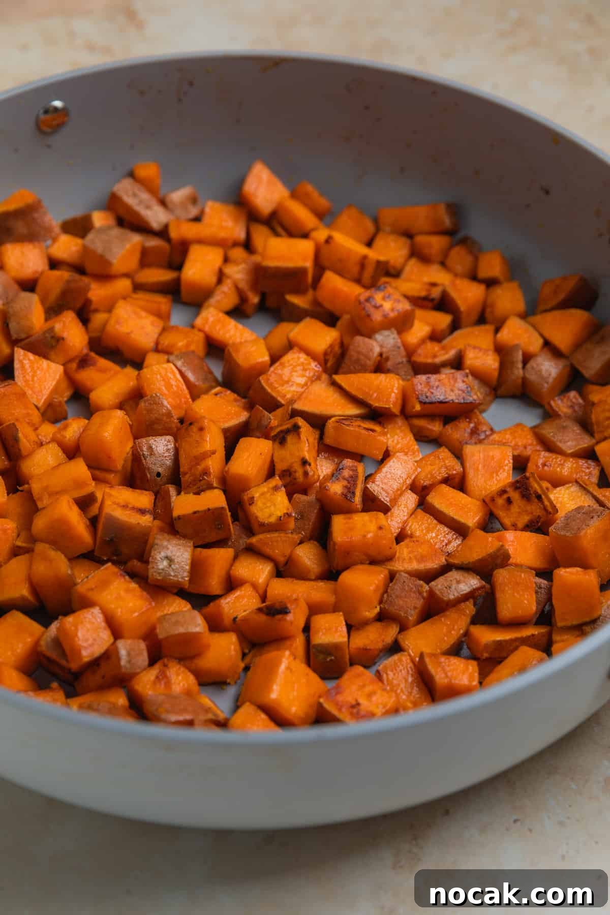 One-Pan Ground Turkey and Sweet Potato Skillet 6 Sweet potatoes cooked in an even layer in skillet.