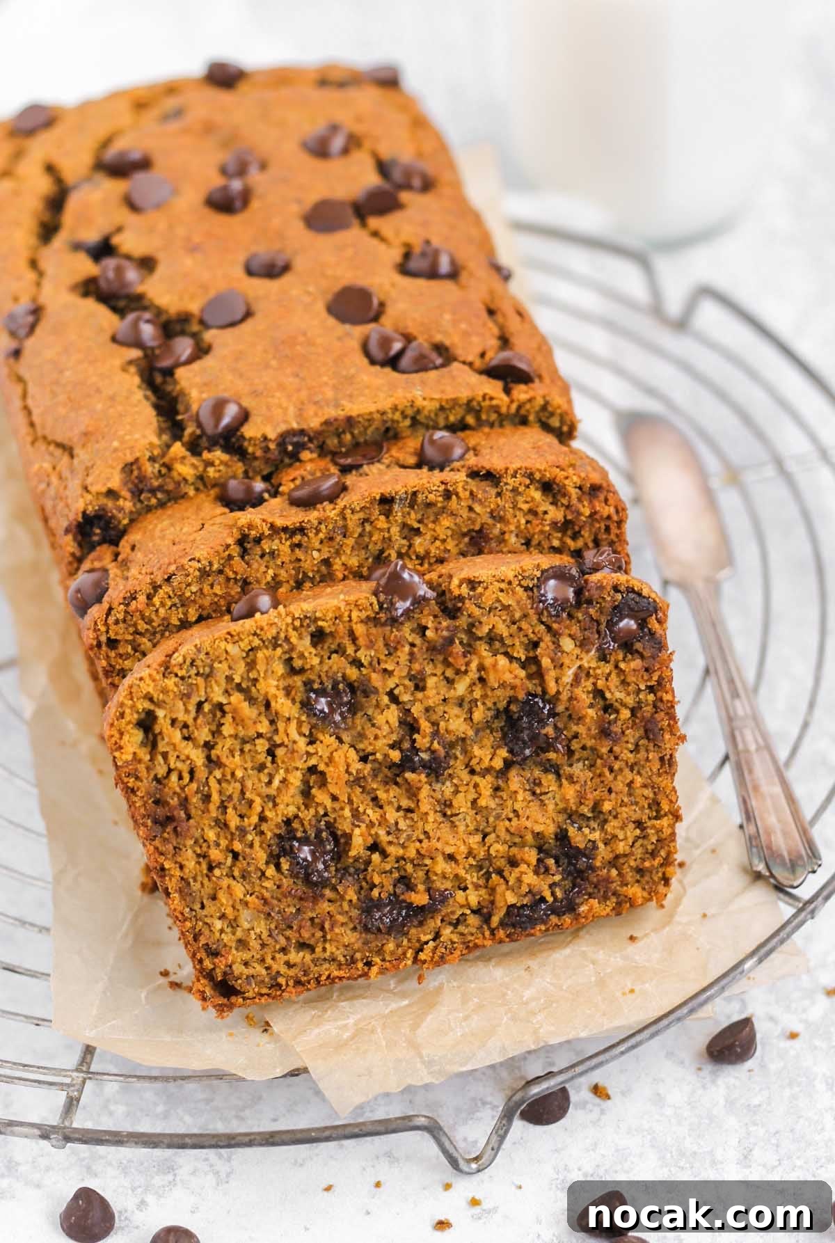 Half sliced loaf of pumpkin chocolate chip bread.