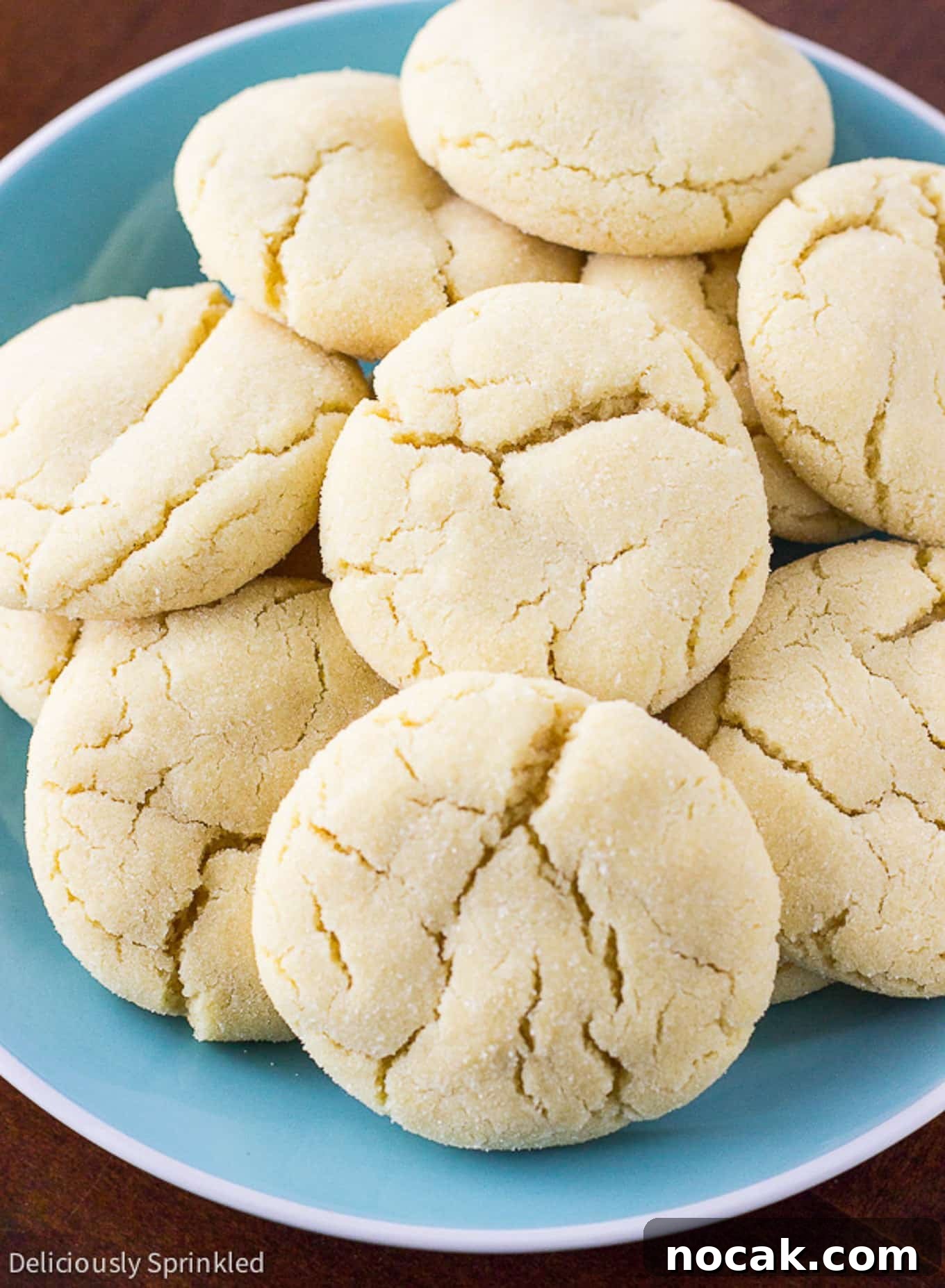 Classic Soft Sugar Cookies Recipe 6 A pile of easy sugar cookies on a plate on the table.
