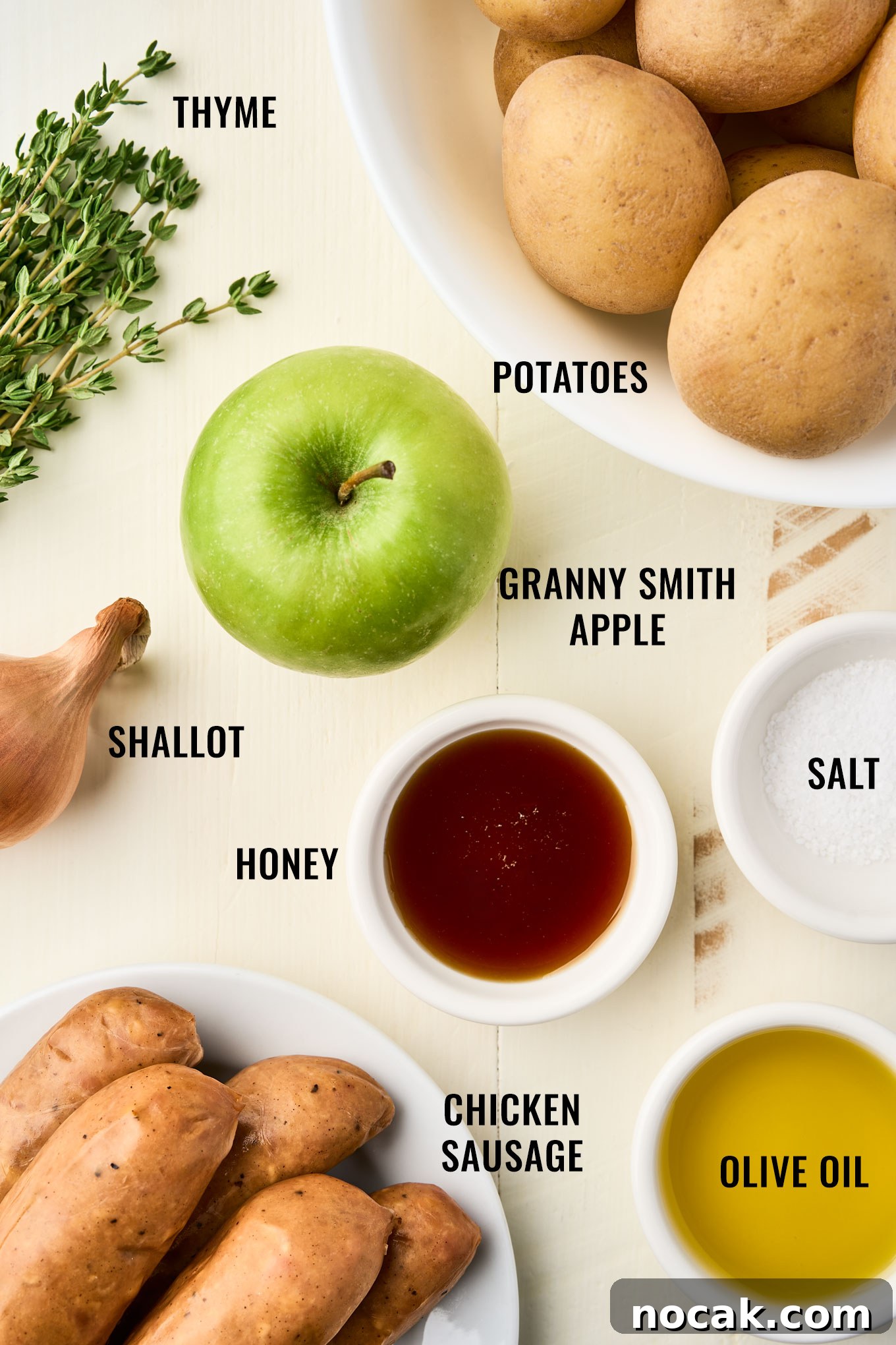 Sheet Pan Chicken Sausage with Roasted Apples 3 Ingredients for a chicken sausage with apples recipe including baby gold potatoes, Granny Smith apple, shallot, fresh thyme, honey, salt, olive oil, and chicken sausage.