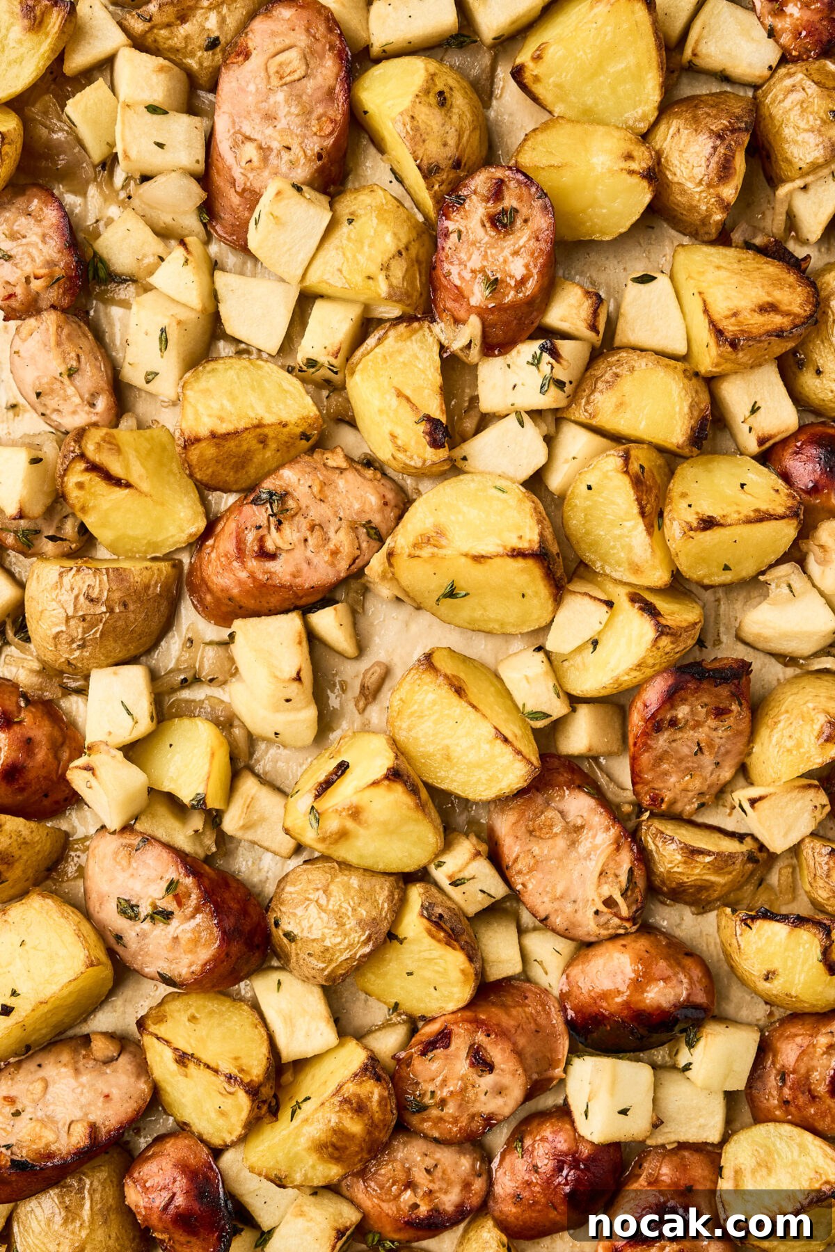 Sheet Pan Chicken Sausage with Roasted Apples 7 Golden roasted chicken sausage, apples, and potatoes straight from the oven for a hearty one-pan chicken sausage with apples recipe.