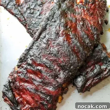 St. Louis-Style BBQ Ribs Recipe for Tender, Sticky Glaze 7 Two slabs of BBQ pork spareribs.