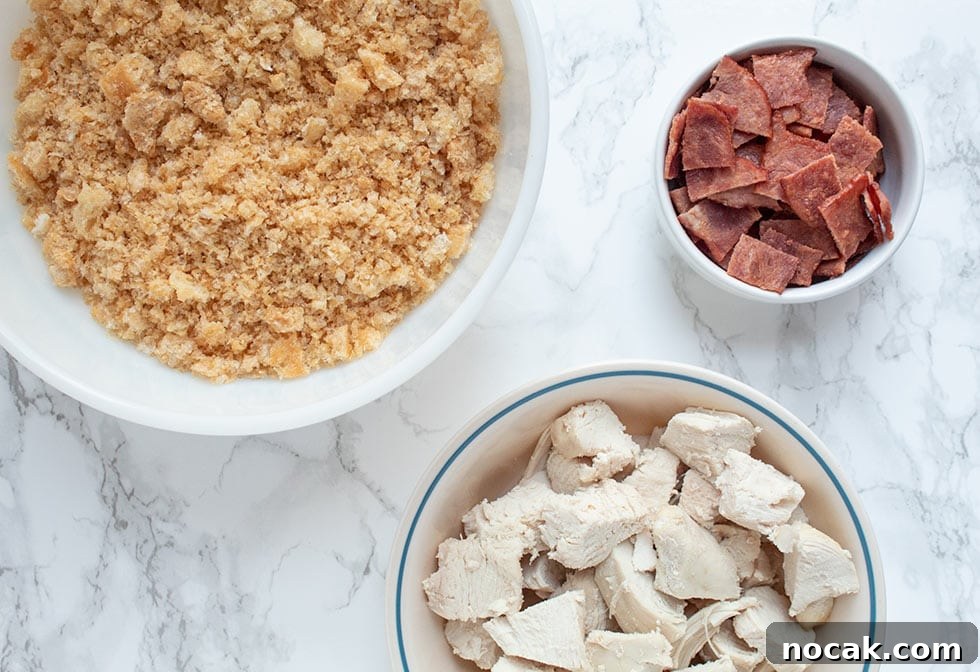 Ritzy Keto Chicken Casserole with Crispy Pork Rind Topping 5 keto casserole ingredients on a countertop in white bowls