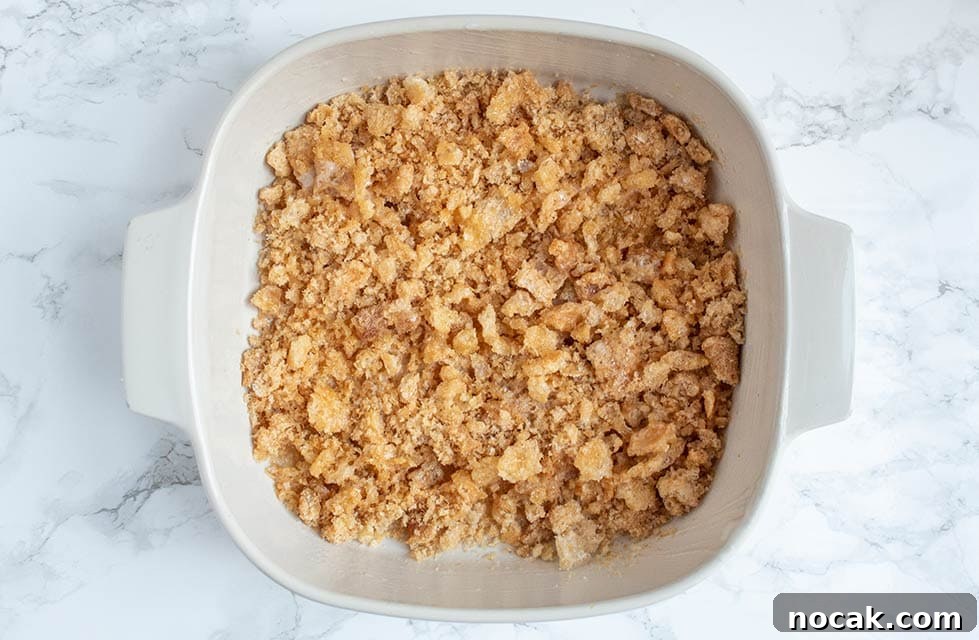Ritzy Keto Chicken Casserole with Crispy Pork Rind Topping 6 keto casserole dish with crushed pork rinds at the bottom of the dish