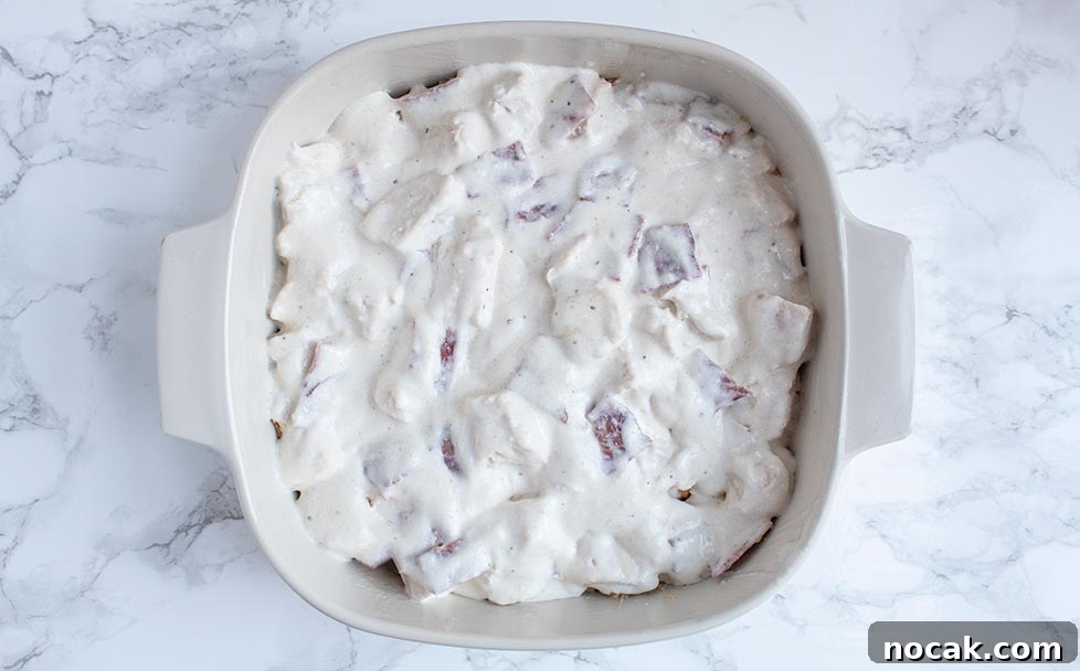 Ritzy Keto Chicken Casserole with Crispy Pork Rind Topping 7 keto casserole with creamy chicken filling covering the top