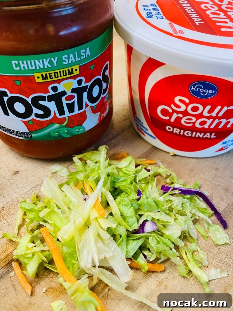 Air Fryer Crispy Shrimp Tacos with Tangy Lime Slaw 4 Taco toppings ready for assembly