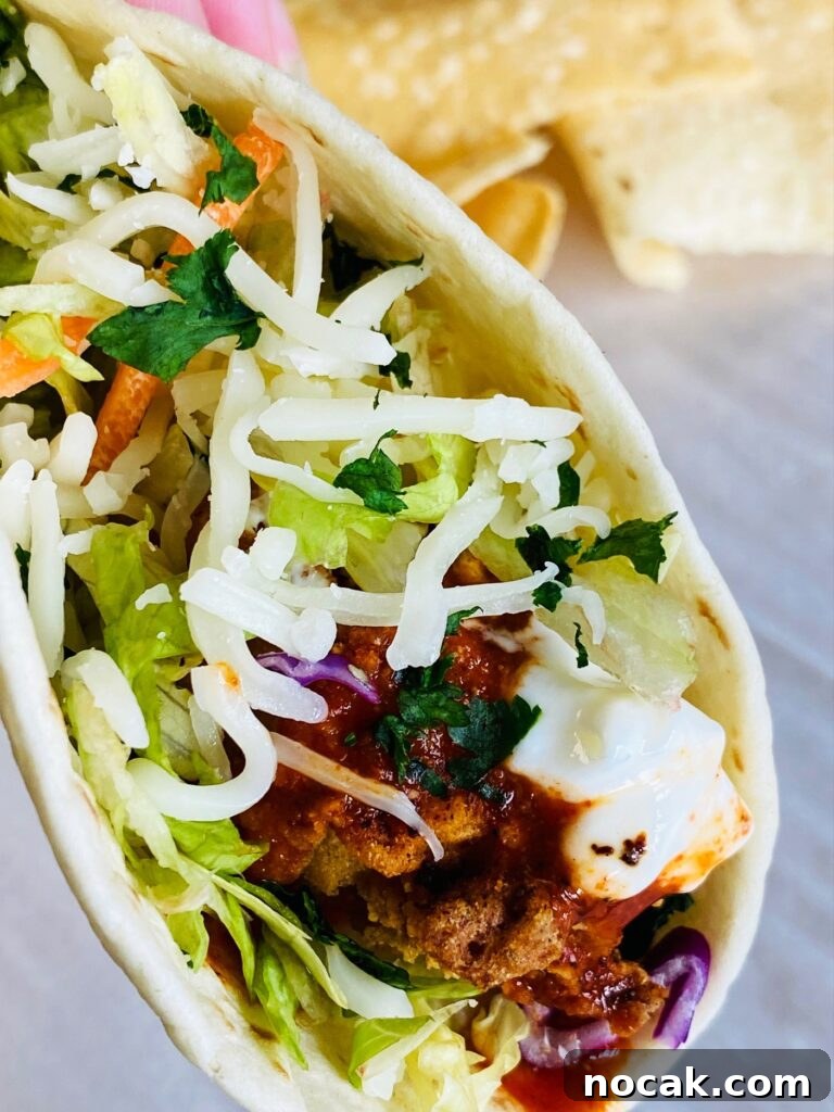 Air Fryer Crispy Shrimp Tacos with Tangy Lime Slaw 7 Close up of crispy shrimp taco