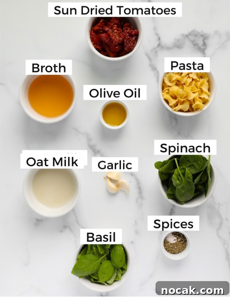 Creamy Tuscan Garlic Pasta with Sun Dried Tomatoes 3 Small white bowls with ingredients that are labeled including sun dried tomatoes, broth, olive oil, pasta, oat milk, garlic, spinach, basil, spices.