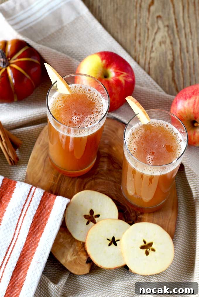 Harvest Shandy: Autumn Apple Beer Cocktail 2 Harvest Shandy on tall glasses over a wooden board