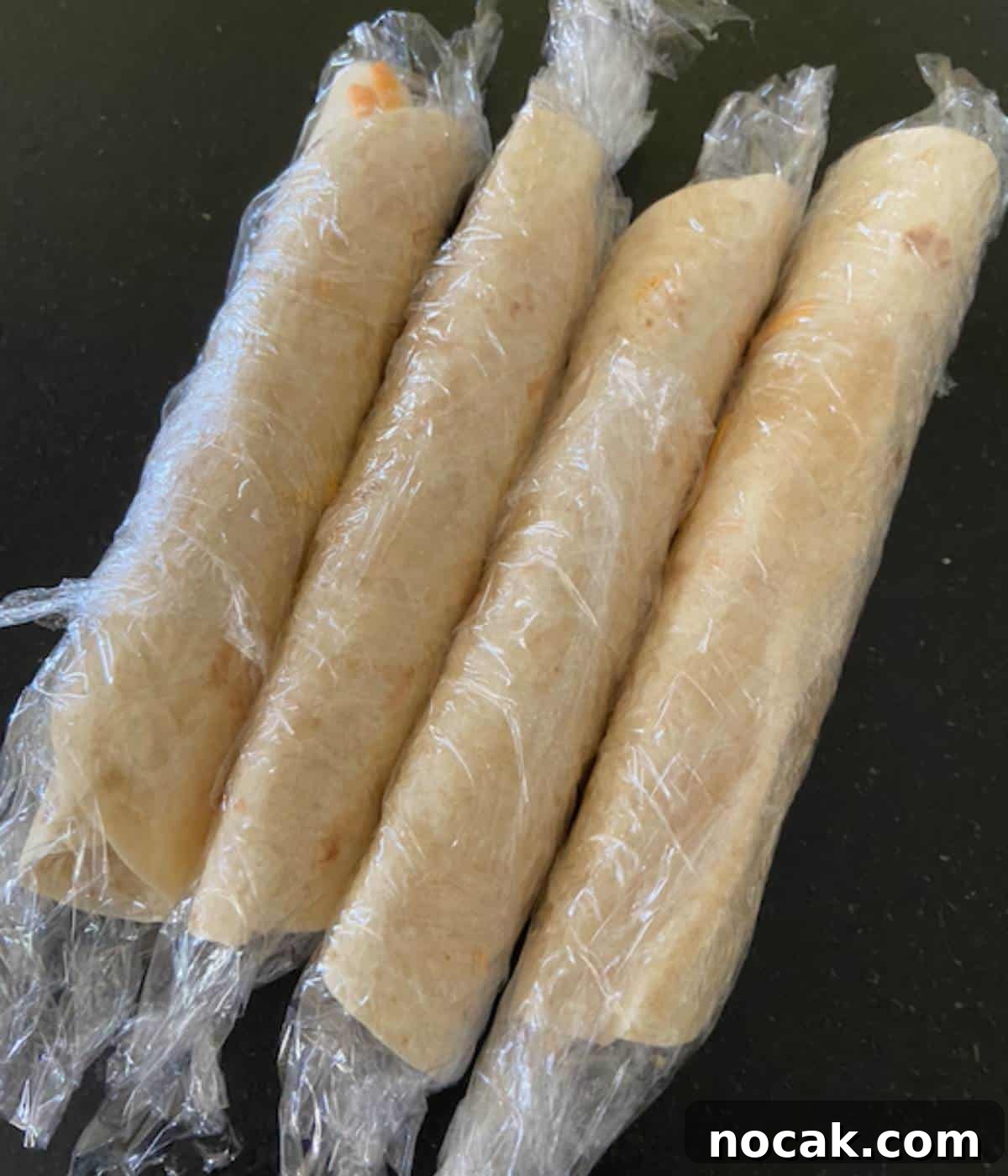 Turkey roll ups in plastic wrap.